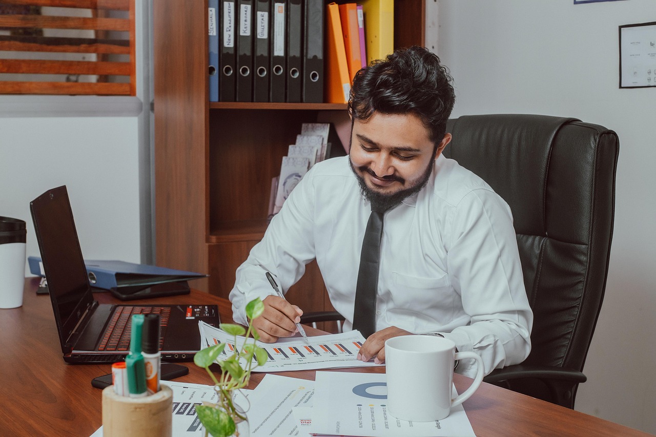Accountant reviewing figures at a modern office desk